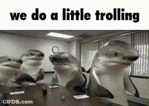 A Group Of Sharks Are Standing In A Room With The Words We Do A Little Trolling Above Them . GIF