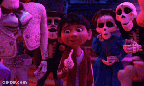 A Group Of Skeletons Are Standing Around A Young Boy Pointing GIF