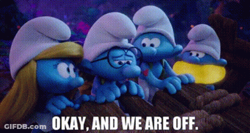 A Group Of Smurfs Are Standing Next To Each Other On Top Of A Rock . GIF