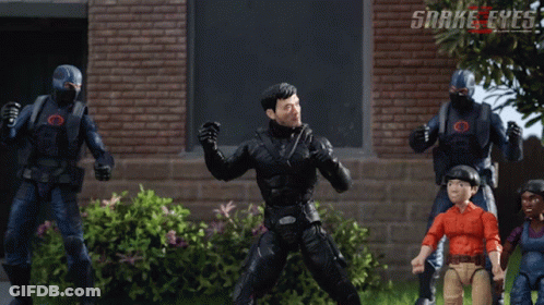 A Group Of Snake Eyes Action Figures Are Standing In Front Of A Brick Wall GIF