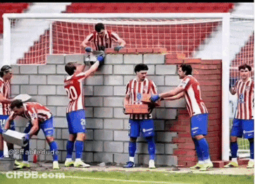 A Group Of Soccer Players Are Building A Wall GIF