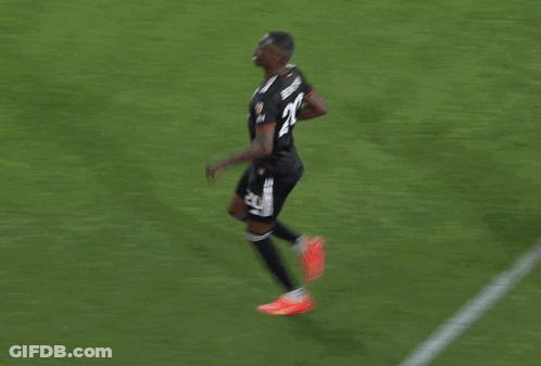 A Group Of Soccer Players Are Celebrating A Goal And One Of Them Has The Number 23 On His Back GIF