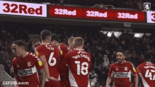 A Group Of Soccer Players Are Celebrating A Goal With The Number 6 On The Back Of Their Jersey GIF