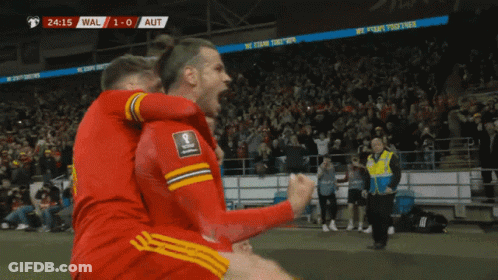 A Group Of Soccer Players Are Celebrating A Goal With The Score At 1-0 GIF