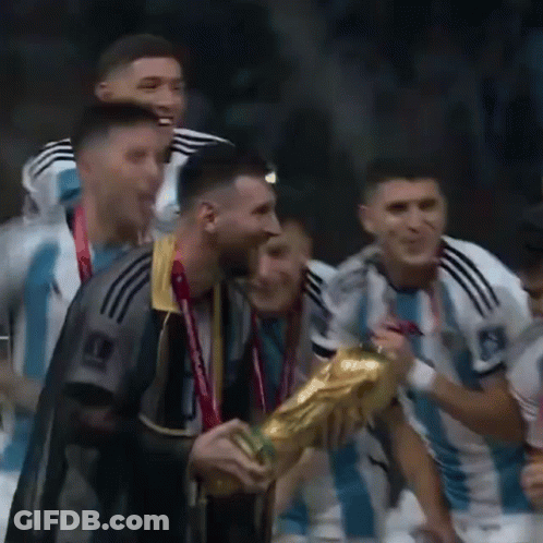 A Group Of Soccer Players Are Celebrating With A Trophy In Their Hands . GIF