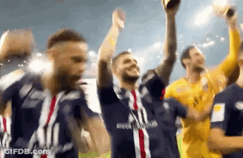 A Group Of Soccer Players Are Celebrating With A Trophy In Their Hands . GIF