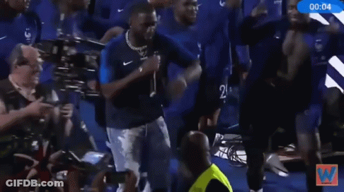 A Group Of Soccer Players Are Dancing In Front Of A Sign That Says Brian On It GIF