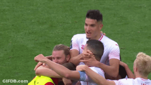 A Group Of Soccer Players Are Huddled Together With One Wearing A Jersey That Says " Pacific Medical " GIF