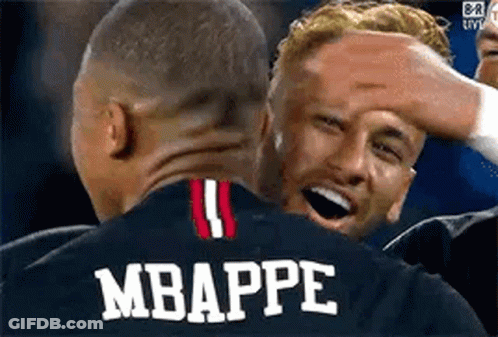 A Group Of Soccer Players Are Hugging Each Other And One Of Them Is Wearing A Jersey With The Name Mbappe On It . GIF