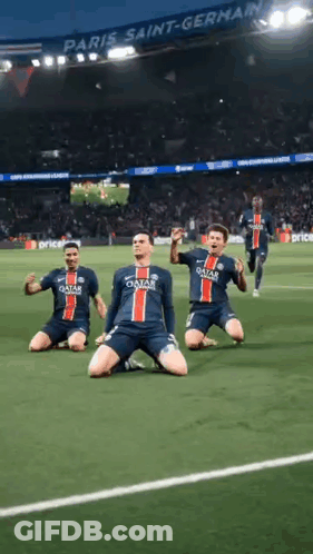A Group Of Soccer Players Are Kneeling On The Field In Front Of A Crowd . GIF