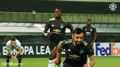 A Group Of Soccer Players Are On A Field With A Fedex Ad In The Background GIF