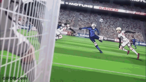 A Group Of Soccer Players Are Playing A Game Of Soccer On A Field In Front Of A Crowd . GIF