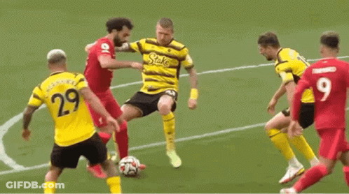 A Group Of Soccer Players Are Playing A Game Of Soccer On A Soccer Field . GIF