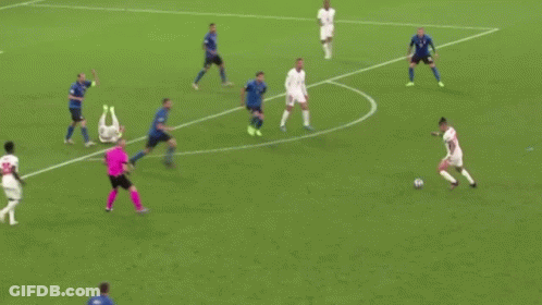 A Group Of Soccer Players Are Playing A Game Of Soccer On A Soccer Field . GIF