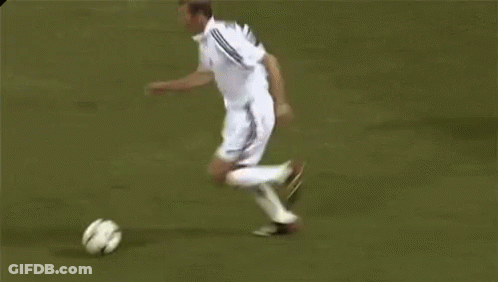 A Group Of Soccer Players Are Playing A Game On A Field And One Of Them Is Wearing A Number 5 Jersey . GIF