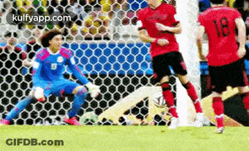 A Group Of Soccer Players Are Playing A Game On A Field . One Of The Players Has The Number 18 On His Shirt . GIF