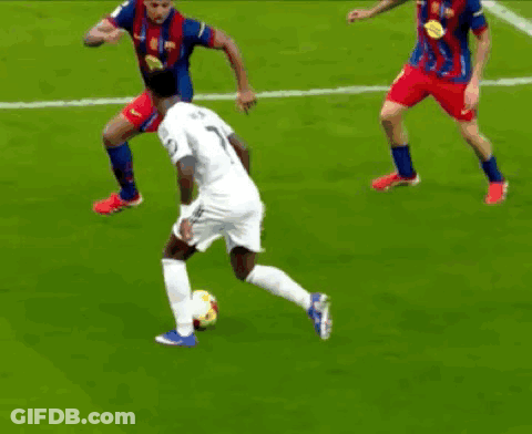 A Group Of Soccer Players Are Playing A Game On A Field GIF