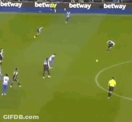 A Group Of Soccer Players Are Playing A Game On A Field With Betting Advertisements In The Background . GIF