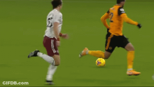 A Group Of Soccer Players Are Playing A Game On A Green Field GIF