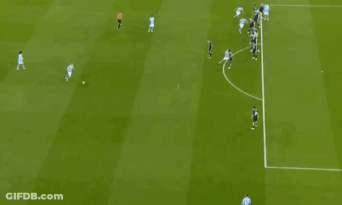 A Group Of Soccer Players Are Playing A Game On A Green Field GIF