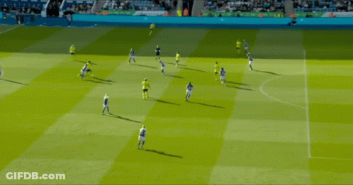 A Group Of Soccer Players Are Playing On A Field And One Of Them Is Wearing A Yellow Shirt GIF