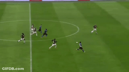 A Group Of Soccer Players Are Playing On A Field And One Player Has The Number 15 On His Jersey GIF