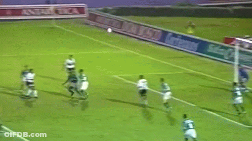 A Group Of Soccer Players Are Playing On A Field With A Banner That Says Antarctica GIF