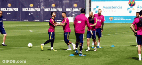 A Group Of Soccer Players Are Playing On A Field With A Nike Banner In The Background GIF