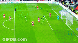 A Group Of Soccer Players Are Playing On A Field With A Sign That Says ' Allianz ' On It GIF
