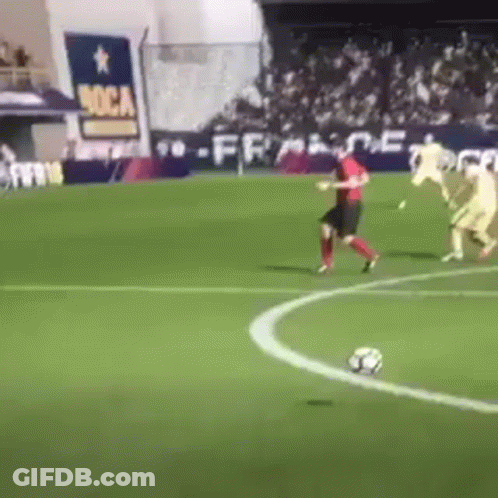 A Group Of Soccer Players Are Playing On A Field With A Sign That Says Boca On It GIF