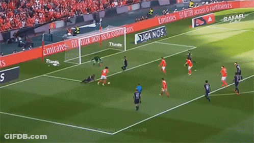A Group Of Soccer Players Are Playing On A Field With Advertisements For Emirates GIF