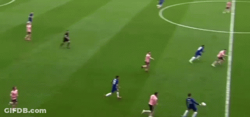 A Group Of Soccer Players Are Playing On A Field With The Words " Through Ball " Written On The Bottom . GIF