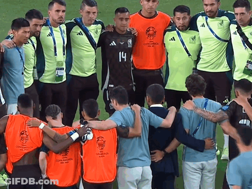 A Group Of Soccer Players Are Posing For A Photo And One Of Them Is Wearing Number 14 GIF