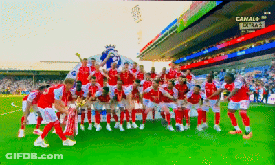 A Group Of Soccer Players Are Posing For A Picture On A Field With The Words Canal + Extra In The Background GIF