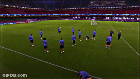 A Group Of Soccer Players Are Practicing On A Field With A Sign That Says ' Allianz ' On It GIF
