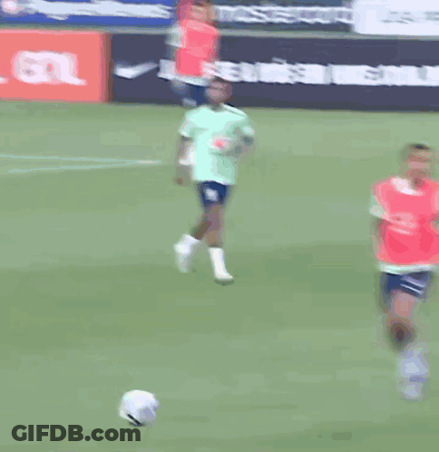 A Group Of Soccer Players Are Running On A Field In Front Of A Tcl Advertisement GIF