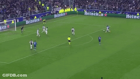 A Group Of Soccer Players Are Running On A Field . One Of The Players Is Wearing A Fly Emirates Jersey . GIF