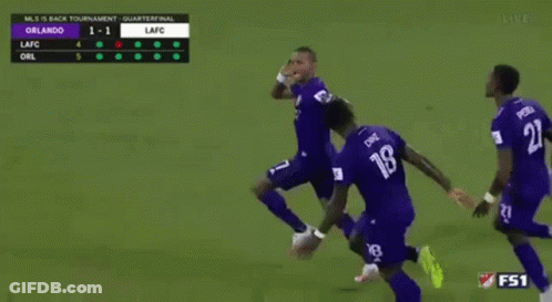 A Group Of Soccer Players Are Running On A Field With The Number 18 On Their Jersey GIF
