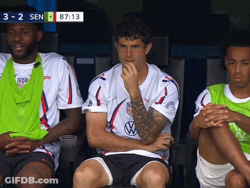 A Group Of Soccer Players Are Sitting In The Dugout With The Score 3-2 Sen GIF
