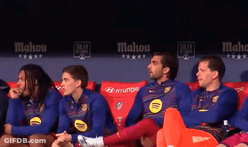 A Group Of Soccer Players Are Sitting On A Couch With Hyundai Written On The Back GIF