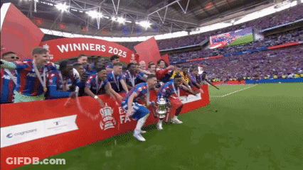 A Group Of Soccer Players Are Standing In Front Of A Sign That Says " Winners 2025 " GIF