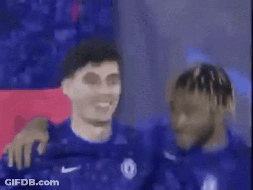 A Group Of Soccer Players Are Standing Next To Each Other And One Of Them Is Smiling . GIF