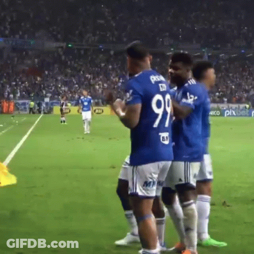 A Group Of Soccer Players Are Standing On A Field And One Of Them Has The Number 99 On His Jersey GIF