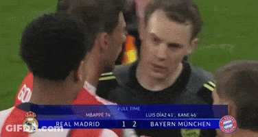 A Group Of Soccer Players Are Standing On A Field And One Of Them Is Wearing A Shirt With The Letter T On It GIF