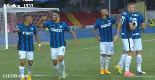 A Group Of Soccer Players Are Standing On A Field Wearing Jerseys That Say Irelli GIF