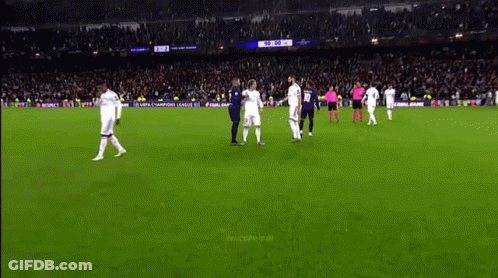 A Group Of Soccer Players Are Standing On A Field With A Sign That Says Fifa Champions League GIF