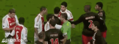 A Group Of Soccer Players Are Standing On A Field With One Wearing A Number 14 Jersey GIF