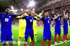 A Group Of Soccer Players Are Standing On A Field With Their Arms Outstretched And One Has The Number 3 On His Shirt GIF