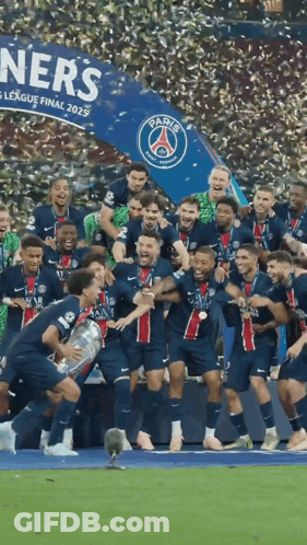 A Group Of Soccer Players Holding A Trophy In Front Of A Sign That Says Paris GIF