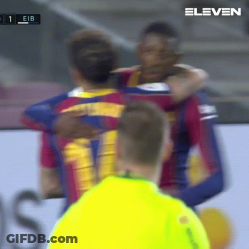 A Group Of Soccer Players Hugging Each Other With The Number 11 On The Back GIF